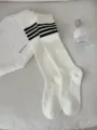 White knee-high socks with black four-bar stripes, classic Japanese JK style sports wear. - Women's 35-39 / Milky White