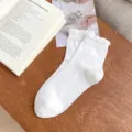 White women mid-tube socks with sweet bubble lace and cute hollow bow embroidery. - One Size / White
