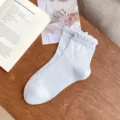 Light blue ruffle cuff mid-calf socks for women featuring cute bow patterns, soft daily wear. - One Size / Light Blue