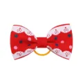Vista dettagliata del fiocco per capelli in nastro grosgrain rosso con pois colorati - Stile 7
