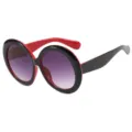 Übergroße runde Sonnenbrille mit einem schwarz-roten Rahmen und lila Verlaufsgläsern. - Kupferrot
