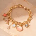 Elegant gold link bracelet featuring ocean-themed enamel dolphin and seashell charms. - Drip Oil Pink Dolphin Rhinestone (8# Pink)
