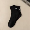 Black cotton mid-tube socks for men with white embroidered arrow design, comfortable. - One Size / Black