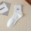 Men's white mid-calf cotton socks with blue letter embroidery, breathable streetwear. - One Size / White