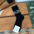 Black Christmas knit socks with white deer and snowflake pattern, warm winter thermal hosiery. - One Size / Black