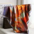 Artistic oil painting style silk scarf detail view, showing rich vibrant colors and smooth texture. - H13