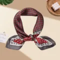 Detailed view of red and grey geometric silk square scarf, elegant fashion neckerchief accessory. - Red