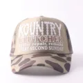 Detailed view of the breathable mesh baseball cap in beige and camo with printed graphic text. - Adjustable / Multi-row Printed Letters - Khaki