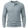 Detail view of men's waffle knit long sleeve henley shirt with button placket texture. - S / Blue