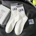 Trendy mens white mid-tube athletic socks with colorful graffiti X pattern for daily wear and sports. - Men's 39-43 / 3XL