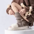 Brown knitted leg warmers paired with plush slippers, stylish y2k streetwear cozy winter footwear accessory. - Khaki