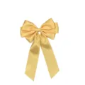 Close-up detail of a triple-layered satin ribbon bow hair clip in champagne yellow. - Lemon Yellow