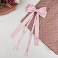 Elegant pink satin bow hair clip with long flowing ribbons for girls hair styling - Pink