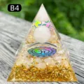 Natural crystal orgone pyramid with gold leaf, crushed stones and Om symbol ornament - B4 Rose Quartz + Rose Quartz Chips / 5cm