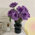 Realistic artificial purple roses in a stylish black tiered ceramic vase for home decor. - Vase Set / Violet