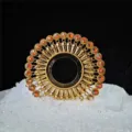 Ornate gold devil's eye sashimi decoration with iridescent stones for luxury seafood platters - Gold Orange Red Style 4