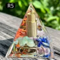 Handmade resin pyramid featuring natural healing crystals and a golden metal coil - Seven Chakra Stones + Coil (R5) / 5cm