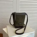 Green suede crossbody phone bag with dark brown leather trim, minimalist style casual shoulder bag. - Moss Green