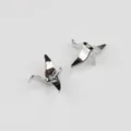 Close up detail shot of silver origami crane metal spacer beads for DIY jewelry design - White K/Silver