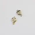 Detailed view of gold alloy heart double hanging jewelry connector with clear zircon inlay. - Hollow Zirconia Style / Gold