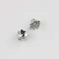 Detailed shot of miniature silver metal umbrella charms, DIY jewelry accessories detail view. - White K/Silver