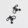 Close-up view of black alloy bow heart charms, perfect for DIY jewelry making details. - 20 Pieces Set / Black