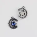 Close-up detail of the alloy moon and star pendant charm showing front and back features clearly. - Gun Black With Blue Zirconia