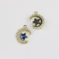 Close-up detail of gold alloy moon star crystal charm pendant for DIY handmade jewelry. - Gold Base Blue Stone