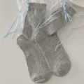 Grey ribbed mid-tube socks for women featuring cute light blue ribbon bows and ruffles. - Women's 35-39 / Light Gray