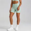 High-waist seamless yoga shorts in mint green, perfect for fitness and active workouts. - Light Green Shorts / S