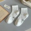 Men's white athletic mid-tube cotton towel sports socks with breathable mesh design. - Crew Socks / White