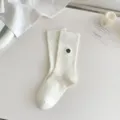 Women white ribbed mid-calf socks with elegant black floral embroidery, chic and premium style. - One Size / Flower White