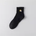 Eleganti calzini di cotone nero a tubo medio da uomo con un ricamo di orso polare. - Taglia unica / Orso