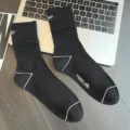 Men's black cotton mid-tube crew socks with white letter embroidery and sports ribbed design. - One Size / Black