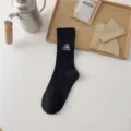 Black ribbed crew socks with embroidered mountain camping design, outdoor cotton mid tube socks. - One Size / Black