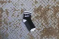 Black and white striped mid-tube cotton socks with stylish skate design for daily wear. - One Size / Black