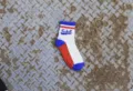 Detailed view of white red blue striped cotton streetwear socks with cool letter print. - One Size / White