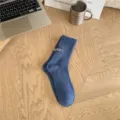 Blue mid-calf ribbed knit socks for men with heel embroidery and textured grid pattern. - One Size / Blue