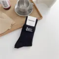 Retro black ribbed cotton mid-calf socks with camping outdoor embroidery and paper tag. - One Size / Black