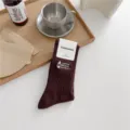 Retro brown ribbed cotton mid-tube socks featuring outdoor camping embroidery design. - One Size / Coffee