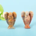 Close-up of hand-carved natural crystal angel figurines with unique stone textures. - 1.5 Inch Crazy Lace Agate Angel