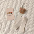 Close-up view of a cute bear nursery wall strap for hair accessory storage and decor. - 3D Bear Hair Accessory Organizer Strap / Coffee