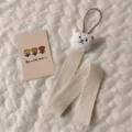 Macro detail of cute white plush bear on a beige woven hair accessory storage strap - 3D Bear Hair Accessory Organizer Strap / White