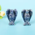 Detailed view of two blue marbled sodalite crystal angel carvings on a blue background - 1.5 Inch Blue Spot Stone Angel