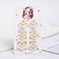 Detailed view of six small heart-shaped pearl hair clips on a cute display card - Heart Style (a18) / 6 Pieces/Pack (Small) / Pearl White