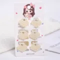 Close-up of six elegant heart-shaped white pearl mini claw clips on a display card - Heart-Shaped Pearl Style (a12) / 6 Pieces/Pack