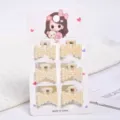 Detailed view of six small elegant pearl claw hair clips on a decorative display card - Bowknot Rectangular Style (a4) / 6 Pieces/Pack