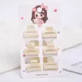 Detail showing six small cream pearl hair claw clips on a cute illustrated display card. - Hollow Rectangular Style (a7) / 6 Pieces/Pack
