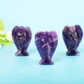 Hand-carved natural amethyst crystal guardian angel figurines on light blue background - 1.5 Inch Amethyst Angel
