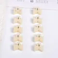 Set of ten mini pearl hair claw clips in creamy white for elegant and gentle hair styling - Symmetrical Triangle Style / 10 Pieces/Pack